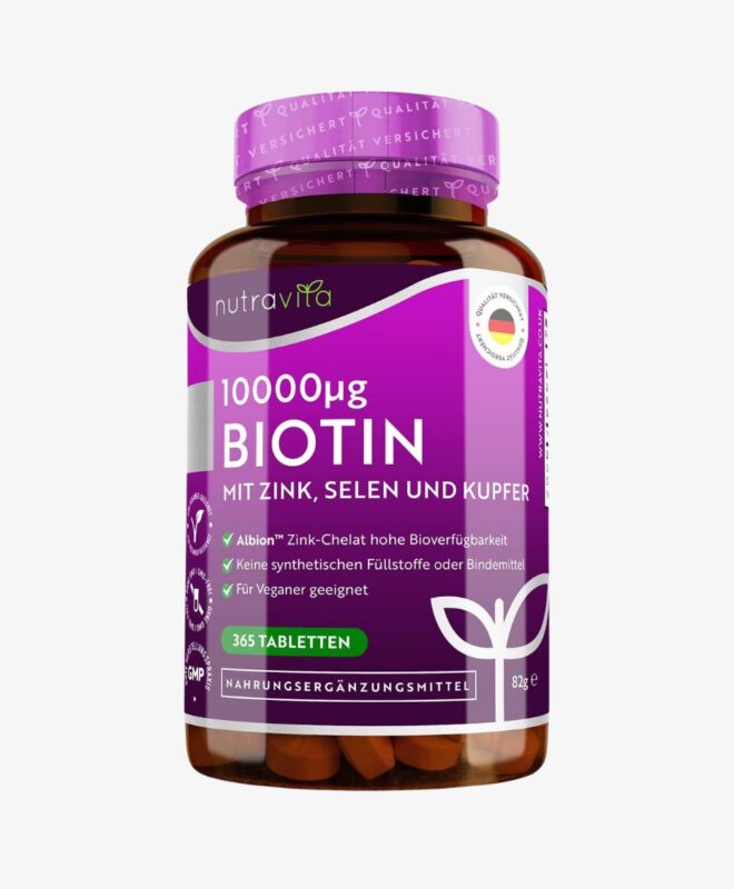 Une bouteille de Nutravita - Biotine 10000 mcg Avec Huile De Coco, Dosage Élevé, 365 Comprimés sur fond blanc.